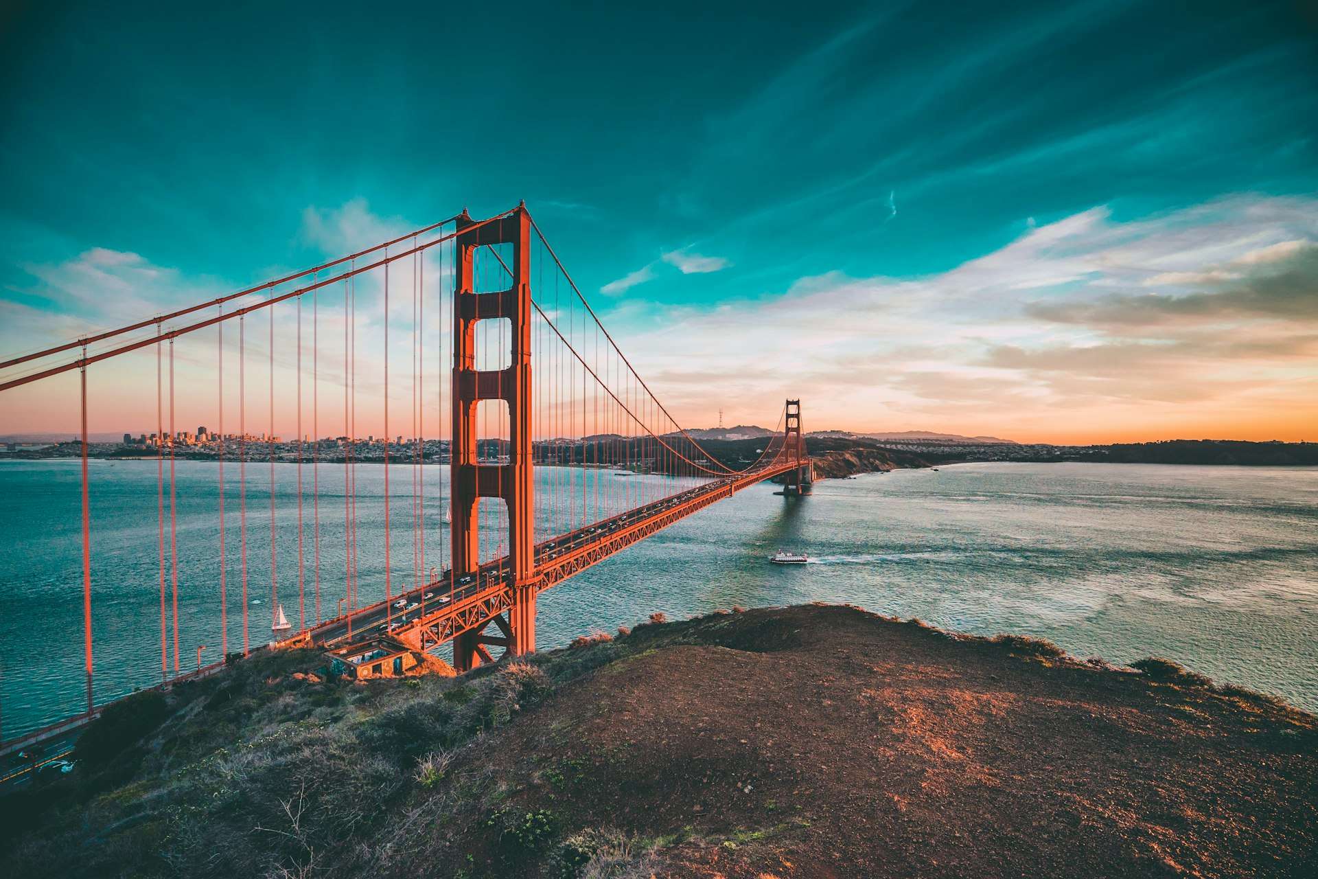 The Golden Gate Bridge at sunset with San Francisco in the distance