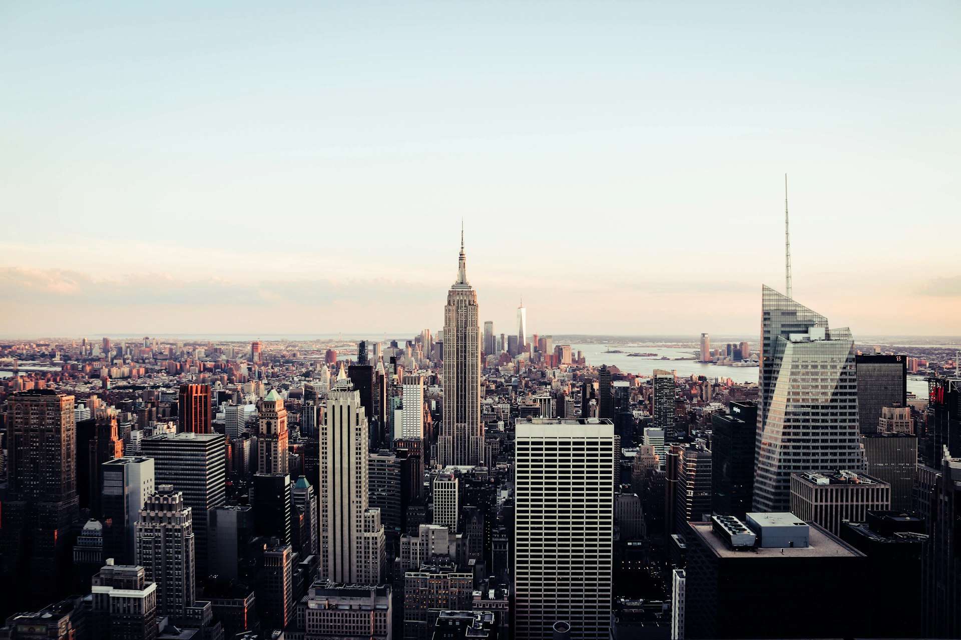 The Manhattan skyline at dusk with the Empire State Building at center